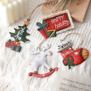 Set of 4 Nordic Christmas iron ornaments featuring reindeer and socks on white fabric