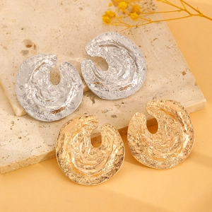 Minimalist textured alloy stud earrings with irregular lava pattern in gold and silver