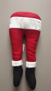 Funny red plush Santa Claus legs with white fur trim and black boots for Christmas decor