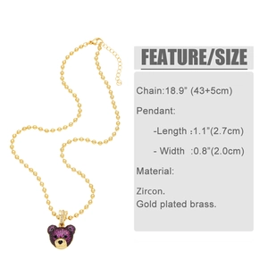 Detail view of purple zircon pave teddy bear pendant on gold plated brass bead chain