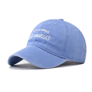 Close-up of California Los Angeles white embroidery on light blue washed cotton baseball cap