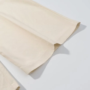 Pantaloni beige a gamba larga in cotone e lino a vita alta con dettagli di pieghe e trama