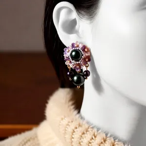 Vintage style floral pearl drop earrings featuring enamel flowers and dark green pearls