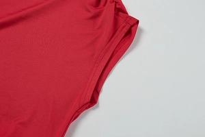 Detail view of red sleeveless dress with high-quality stitching and elastic fabric