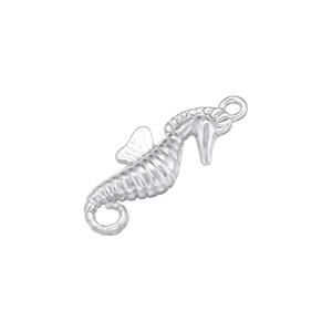 Detailed view of silver seahorse pendant with copper inlaid zircon in hip hop style