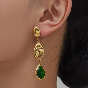 Vintage gold layered earrings with irregular metal texture and green teardrop glass stones