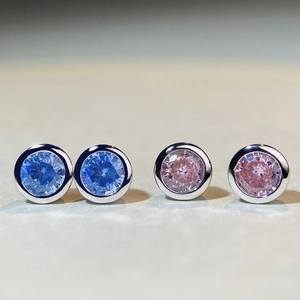 Macro shot of S925 sterling silver bubble studs with blue and pink round zircons
