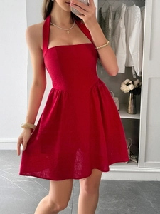 Detail view of red halter neck backless dress with a high-waist A-line silhouette