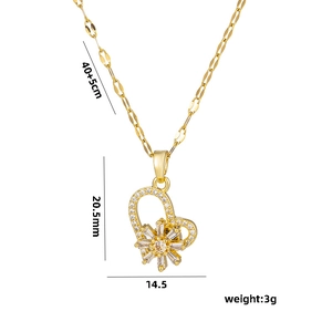 Rotating snowflake heart pendant necklace in gold titanium steel on white background