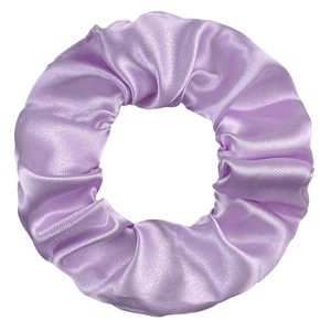 Close-up of purple satin hair scrunchie showing glossy fabric texture and pleated design