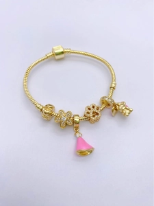 Detail of 18k gold plated bracelet charms with flower, paw print and pink pendants