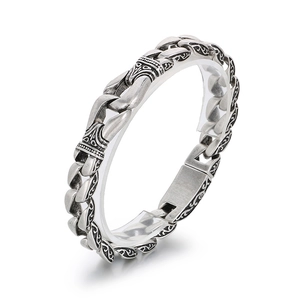 Vintage silver stainless steel men's bracelet with intricate totem relief and antique finish