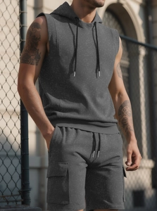 Detail of dark grey sleeveless hoodie set featuring cargo shorts and premium knit texture