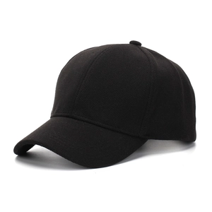 Close-up of black baseball cap showing thick textured wool blend fabric and six-panel design