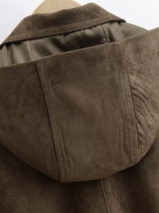Close-up of the hood stitching and faux suede texture on a brown bomber jacket