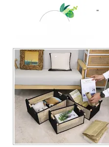 Three sizes of woven storage baskets with wooden handles on a white rug