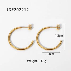 Detail view of gold C-shaped hoop earrings with precise size and weight measurements
