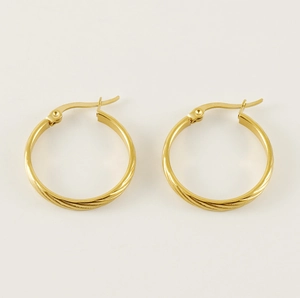 Detailed close-up of golden stainless steel hoop earrings with textured twist design