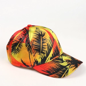 Detail of tropical palm tree print and gradient orange fabric on the baseball cap