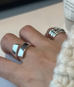 Minimalist 925 sterling silver layered and irregular open rings on model hand