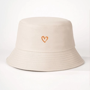 Detail of embroidered orange heart on cream cotton canvas bucket hat for women