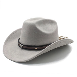 Detailed view of western felt cowboy hat featuring a silver bull head metal ornament
