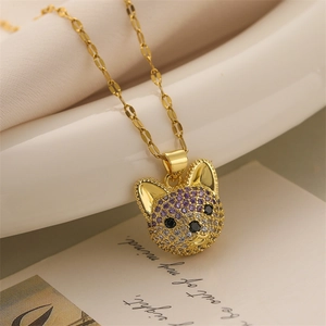 Detailed view of dog pendant necklace with gold finish and colorful zircon stones