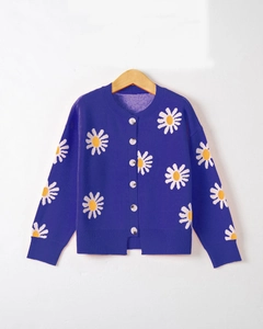 Close-up of purple knit cardigan featuring white daisy embroidery and round buttons
