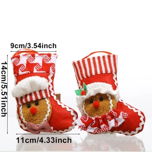 Pair of red knitted Christmas gingerbread man stockings with size dimensions on white back
