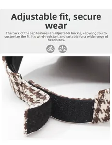 Detailed view of houndstooth baseball cap with adjustable hook and loop back strap