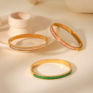 Detailed macro view of 18K gold plated stainless steel bracelets with colorful zircon stones