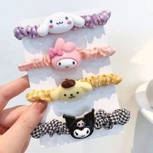 Set of 4 cute cartoon character scrunchies with plaid ribbons and charms in various colors