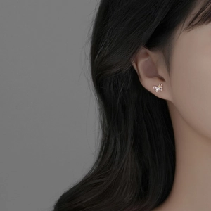Elegant S925 sterling silver butterfly stud earrings with colorful sparkling stones on model