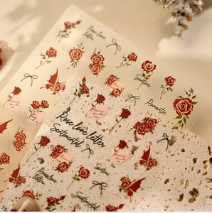 Close-up of TS-4242 rose nail art stickers with vintage floral patterns on stone