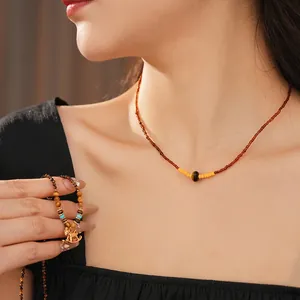 Vintage tiger eye stone necklace with gold rocking horse pendant for women