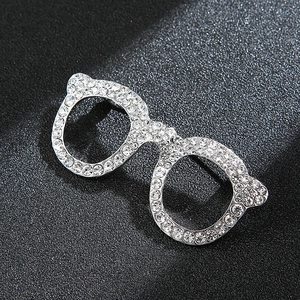 Fashionable silver-toned eyeglasses lapel pin decorated with sparkling white rhinestones
