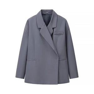 Detailed flat lay of gray blazer with notched lapels and padded shoulders for women