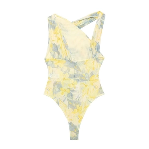Detail of yellow floral bodysuit featuring asymmetric ruffles and sheer mesh fabric