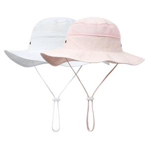 Detail view of white and pink sun hats with mesh paneling and adjustable chin straps