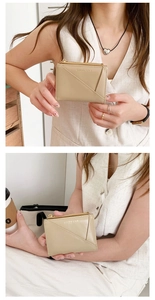 Close-up of beige faux leather compact wallet with metal zipper and embossed logo