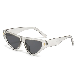 Fashionable cat-eye sunglasses with transparent grey frame and dark lenses in white background