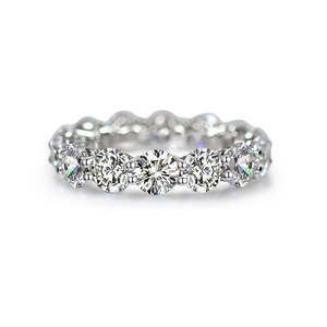 Macro view of sterling silver eternity band featuring round-cut brilliant cubic zirconia