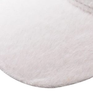 Close-up of high-quality soft white faux rabbit fur texture on a winter baseball cap