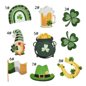 Detail showing St. Patrick's Day embroidered patches with green clovers and gold coins