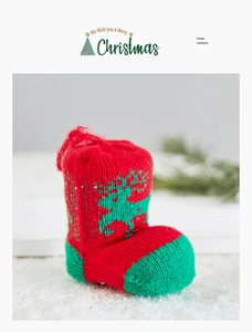 Detail of red and green knitted Christmas boot ornament featuring a reindeer pattern