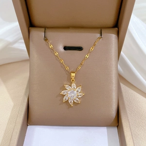Golden titanium steel necklace with a crystal flower pendant in a premium beige jewelry box