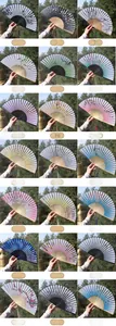 Collection of 21 traditional Chinese folding fans with bamboo ribs and silk tassels
