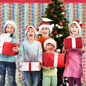 Christmas snowflake tinsel fringe curtain backdrop with kids holding holiday gift boxes