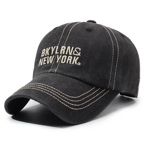 Vintage washed black baseball cap with white New York embroidery and contrast stitching