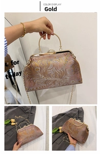 Detail of vintage gold brocade evening bag with phoenix feathers and crystal clasp